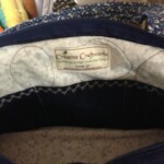 Blue and white fabric bag with a label reading "Creative Craftworks" and contact information on the inside.