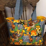 Colorful tote bag with animal print, featuring lions, zebras, and monkeys, hanging on a carved wooden chair with blue straps.