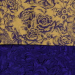 Two sections of floral fabric; one yellow with blue flowers, the other dark blue with intricate swirling patterns.