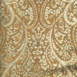 Ornate brown fabric with an intricate paisley design and subtle floral patterns in a complementary cream color.