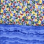 A colorful pattern of letters and numbers above a textured blue pattern.