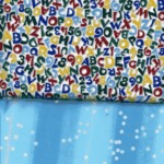 Two fabric patterns: top with colorful letters and numbers; bottom with a blue background and white dots.